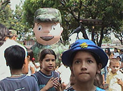 <p>Costumed soldiers try to win hearts and minds, El Paujil, Caquetá, 2004. Photo: Colombian Army</p>