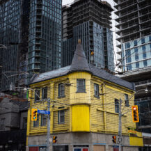 <p>New high-rises crowd a more traditional Toronto building at the corner of Queen and Church streets.</p>