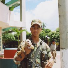 <p>A Colombian soldier with his pet spider monkey.</p>