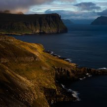 <p>The light from sunrise coating the coast of Suðuroy.</p>