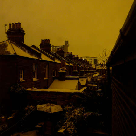 <p>Snow coats a row of homes along Kensal Town's First Avenue, with the Trellick Tower in the distance.</p>