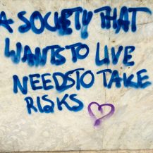 <p>A wall in Athens bears a call to action for a society floored by the recession and debt service that started in 2009 and dragged on through much of the following decade.</p>