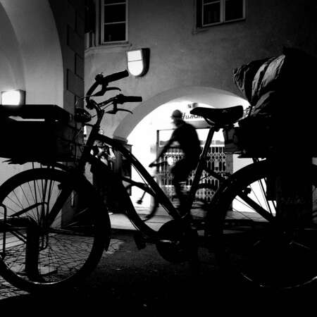 <p>A cyclist passes a stationary cycle. </p>