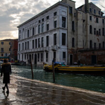 <p>People walk along the fondamenti either side of the Canale di Cannaregio, one of Venice's larger canals. The wake from passing boats washes up over the walkways. </p>