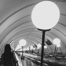 <p>Passengers descending into and ascending out of one of Moscow's very deep metro stations.</p>