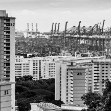 <p>A view over Singapore's public housing blocks and cranes at the city-state's immense container terminals.<br /></p>