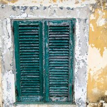 <p>Weathered shutters and walls at Forte São Sebastião, São Tomé.</p>