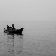 <p>Two fishermen collect a trap, with the crustaceans inside doomed to a dinner plate that evening.</p>