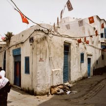 <p>A woman and her children on a backstreet of Tunis's Medina. <br /></p>
<p>The date on the wall refers to the Tunisian general election from the previous year, which (unsurprisingly) saw the highly corrupt president Zine El Abidine Ben Ali 're-elected' for a fourth time – with a mere 94.9 percent of the vote. A few years later, Ben Ali's flagrant misrule sparked the Arab Spring that permanently removed him from power.</p>