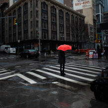 <p>Waiting to cross 27th Street in the rain.<br /></p>
