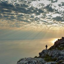 <p>A person enjoys the spectacular views over Cape Town and the ocean from atop Table Mountain. The sky was amazing that day.</p>