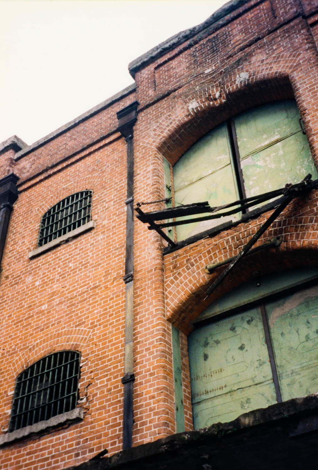 <p>The gentrification of Buenos Aires' Puerto Madero district had not reached very far in the late 1990s. The now-prized warehouses were in various states of dereliction at the time, like this one.</p>