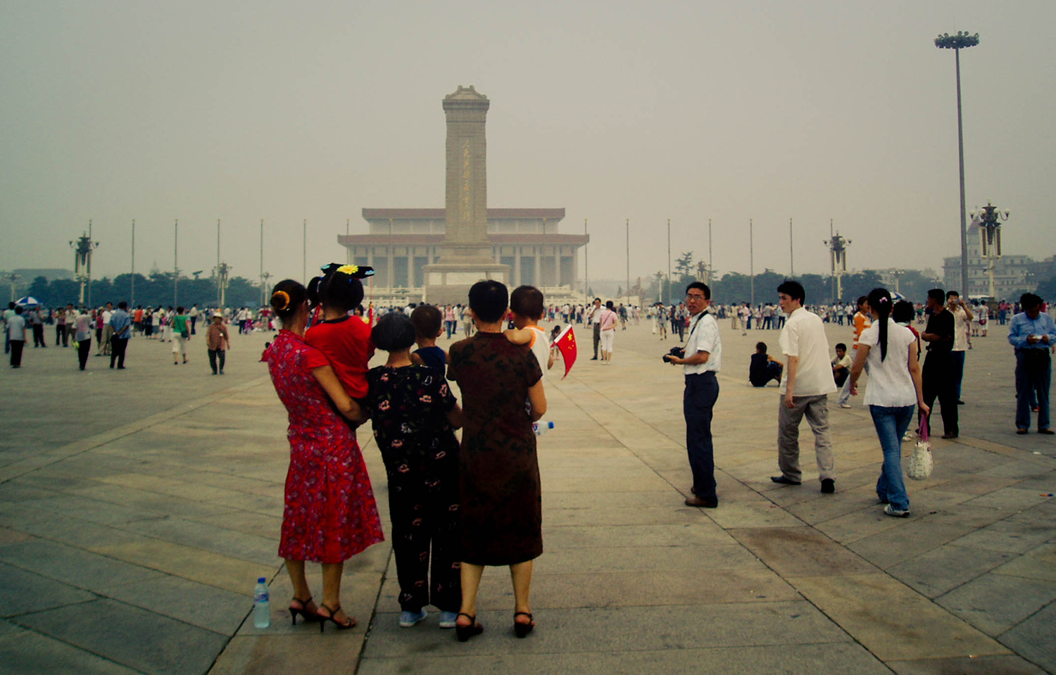 <p>A family poses for a portrait in Tiananmen Square. </p>