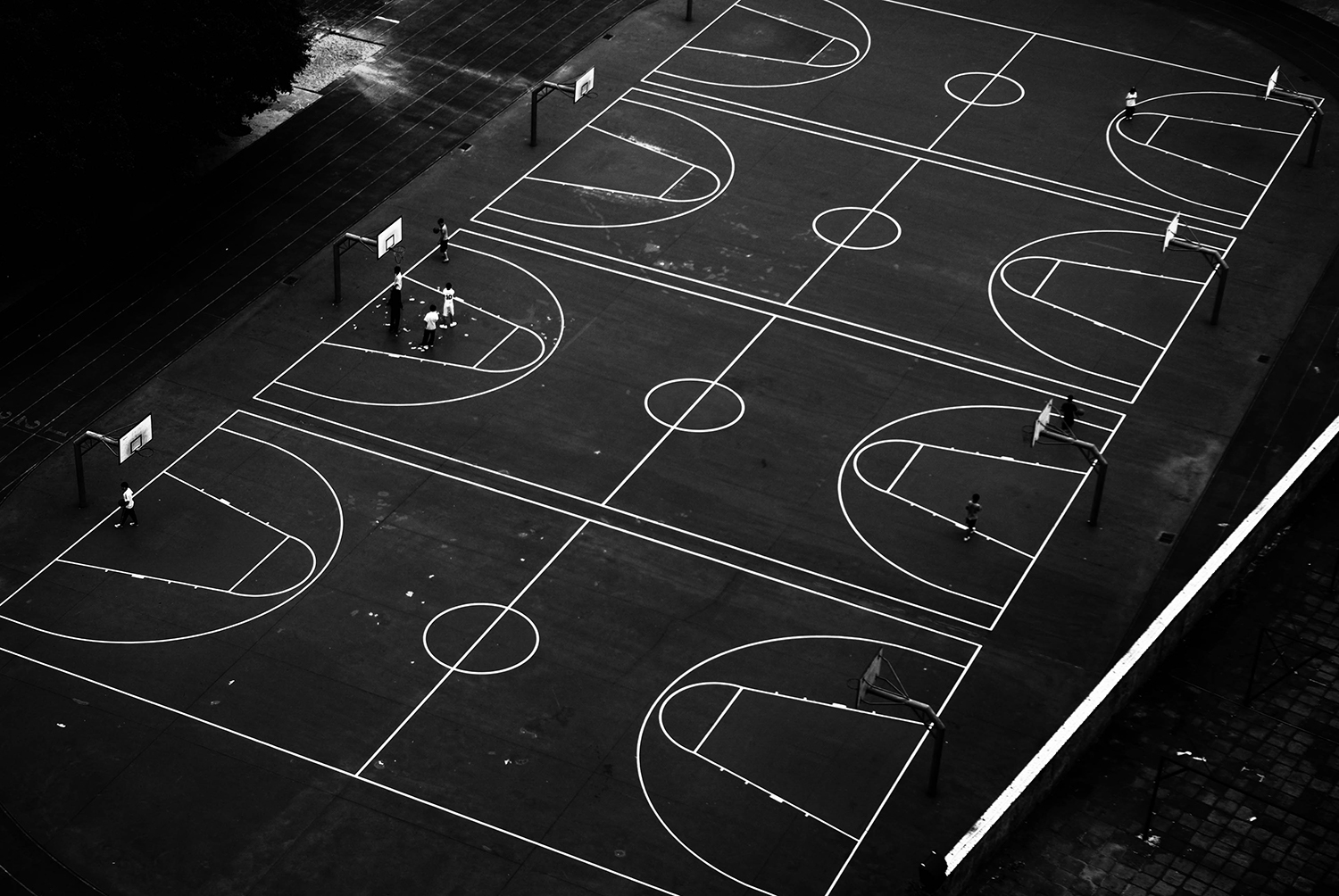 <p>Basketball courts shot from an urban cable car.</p>