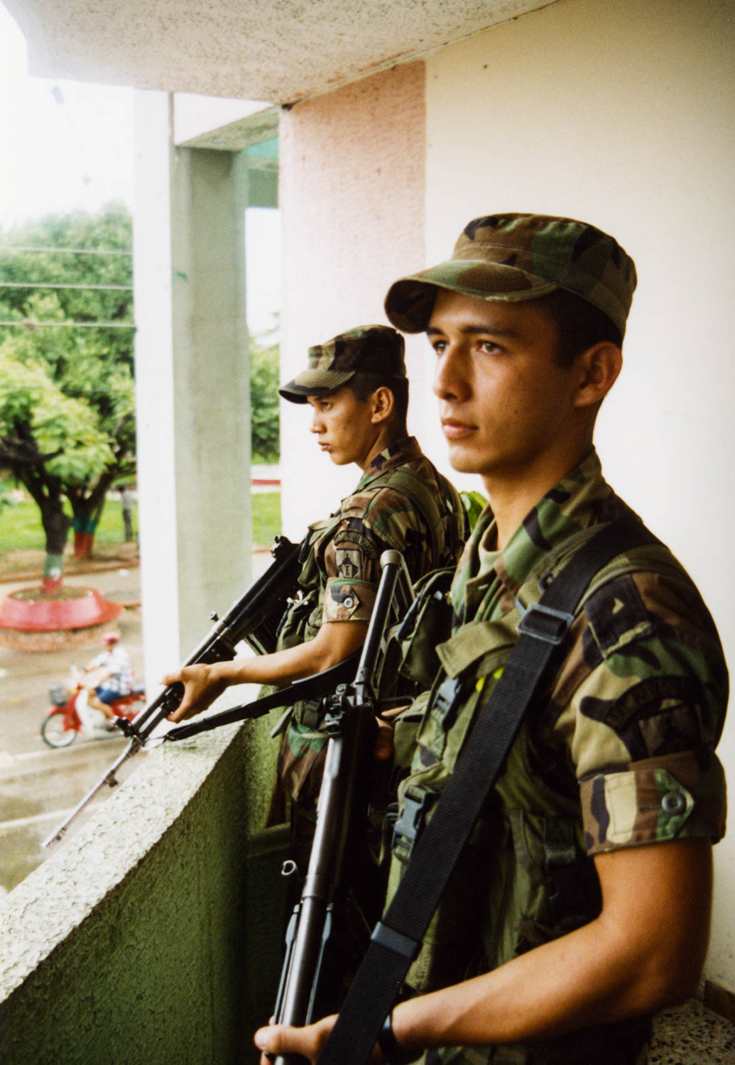 <p>Two soldiers on sentry duty in Tame, Arauca. Both men were part of Colombia's 'Soldados de mi pueblo' initiative, which inducted locally born men into military service in their own communities in an attempt to bolster security. </p>