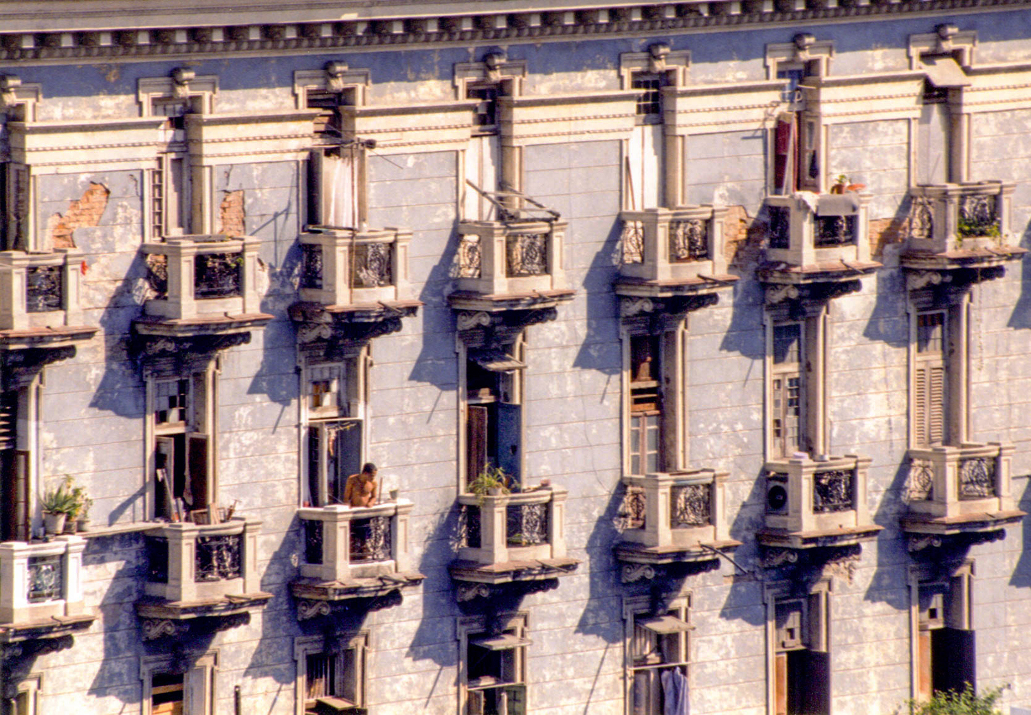<p>A man on a balcony in central Havana.</p>