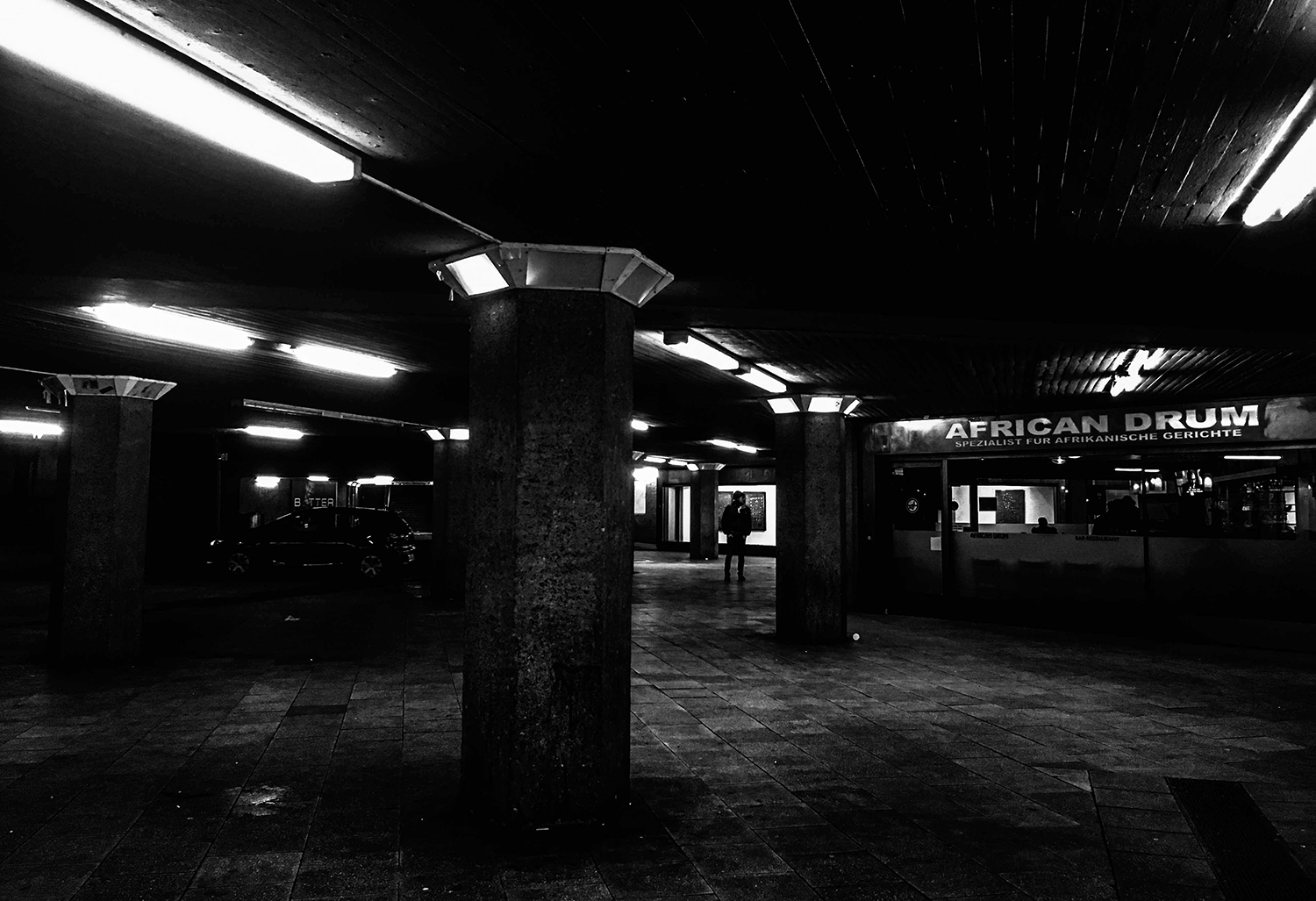 <p>Cologne's Ebertplatz shows its 1970s urban design, provoking the usual love-hate response. While the dark corners of its pedestrian underpasses have raised concerns about crime and safety, these recesses also host art galleries and restaurants (like this Nigerian place).</p>