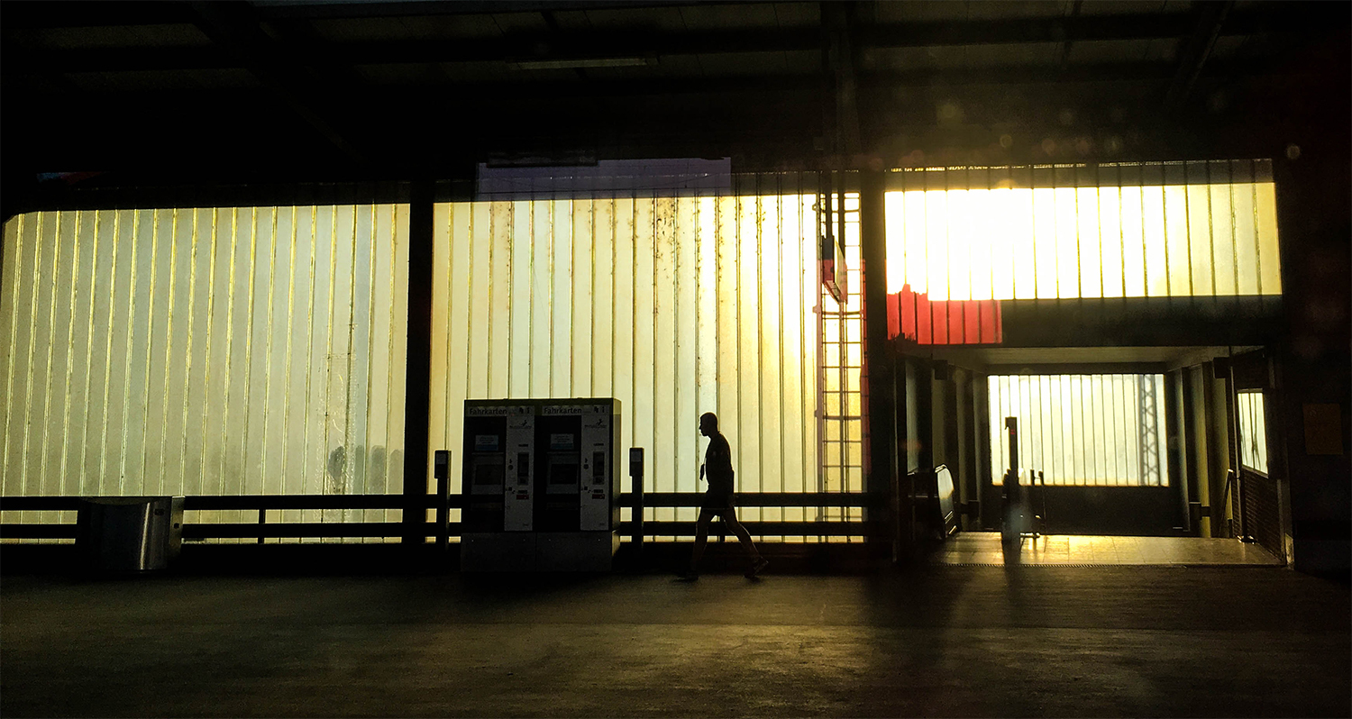 <p>Golden hour and some dirty plate glass windows make for a dramatic train platform.<br /></p>