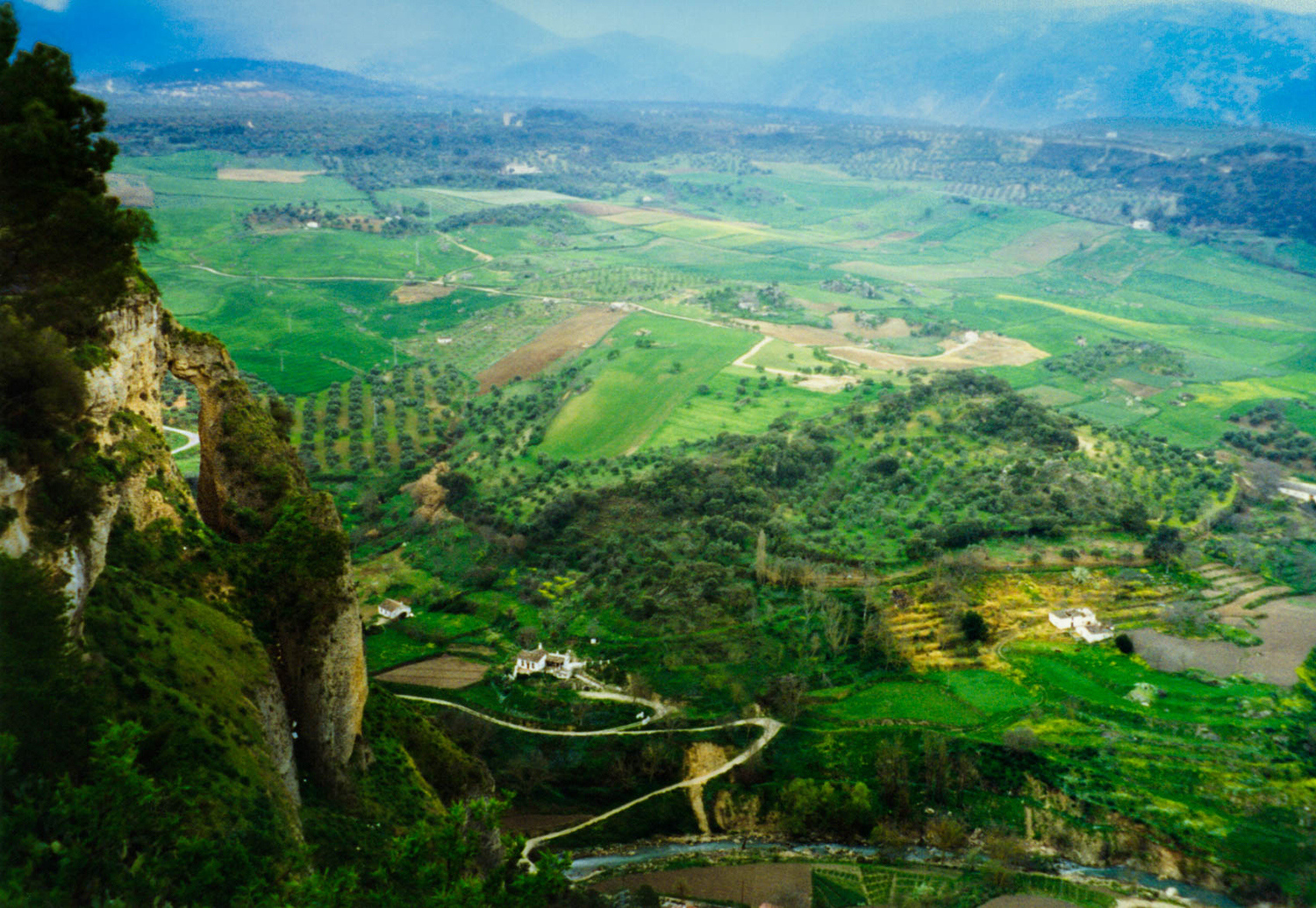 <p>A view over farm fields from the impressive clifftop town of Ronda, in Andalucia.</p>