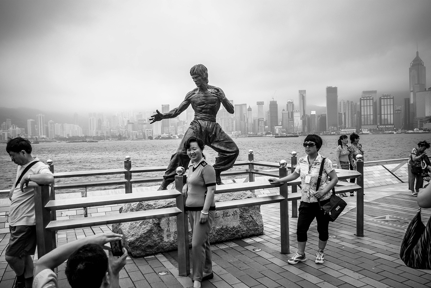 <p>People gather around a statue of Hong Kong film idol Bruce Lee. <br /></p>