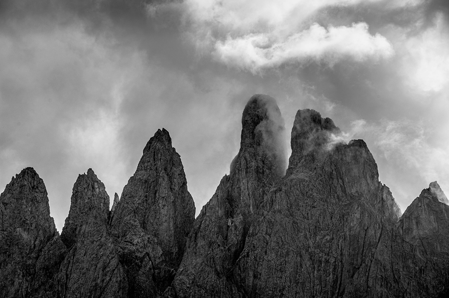 <p>A telephoto shot of the Odle group, some of the signature jagged peaks of the Dolomites. The cloud formations that whip through these teeth are a spectacle to behold.</p>
