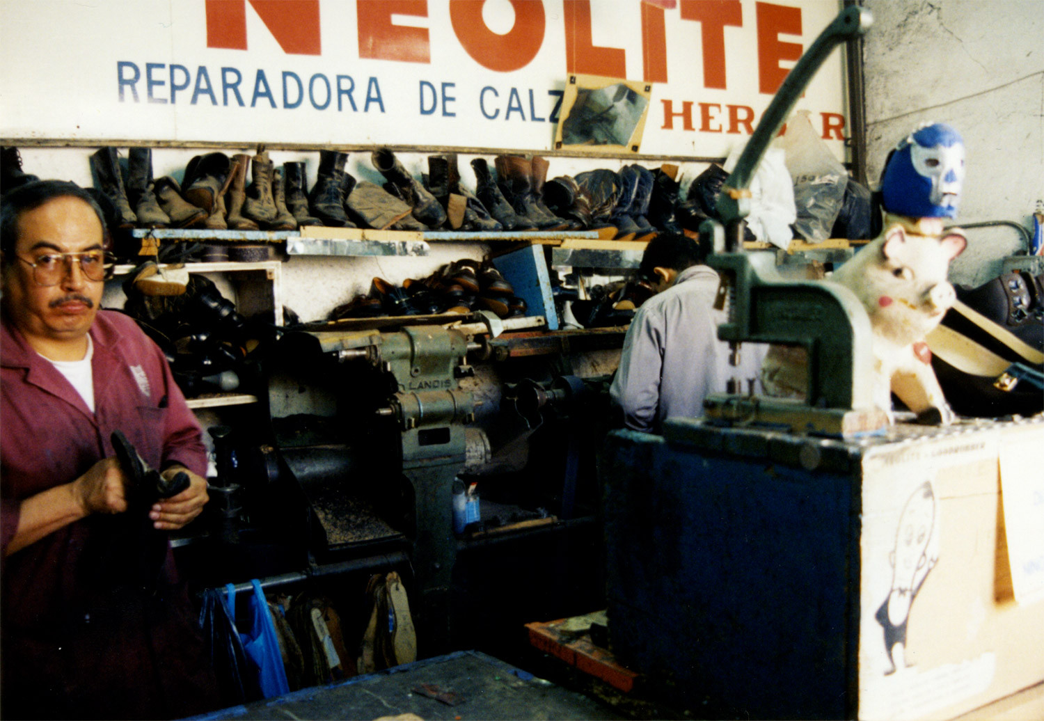 <p>Two Mexico City cobblers in their uniquely decorated workshop. <br /></p>
