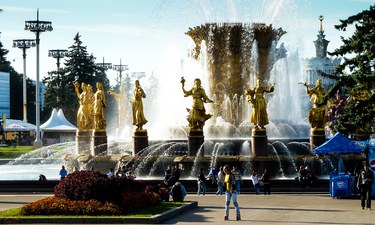 <p>The 'Friendship of Nations' fountain at Moscow's impressive VDNH grounds. Each golden statue represents one of the former republics in the Soviet Union. <br /></p>
<p>The fountain is one of several standout attractions at the Soviet-era Exhibition of Achievements of National Economy (Выставка достижений народного хозяйства, abbreviated to ВДНХ, and translated to VDNH).</p><p>While I went with the colour version of this shot, the black and white brings out some interesting details (see below).</p>
