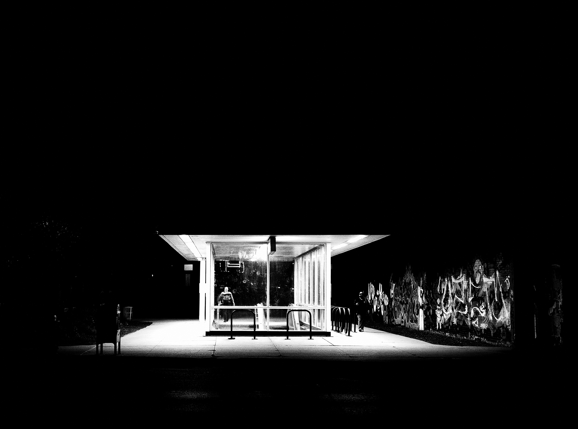 <p>Commuters emerge from one of Chicago's metro stations into a dark night.</p>