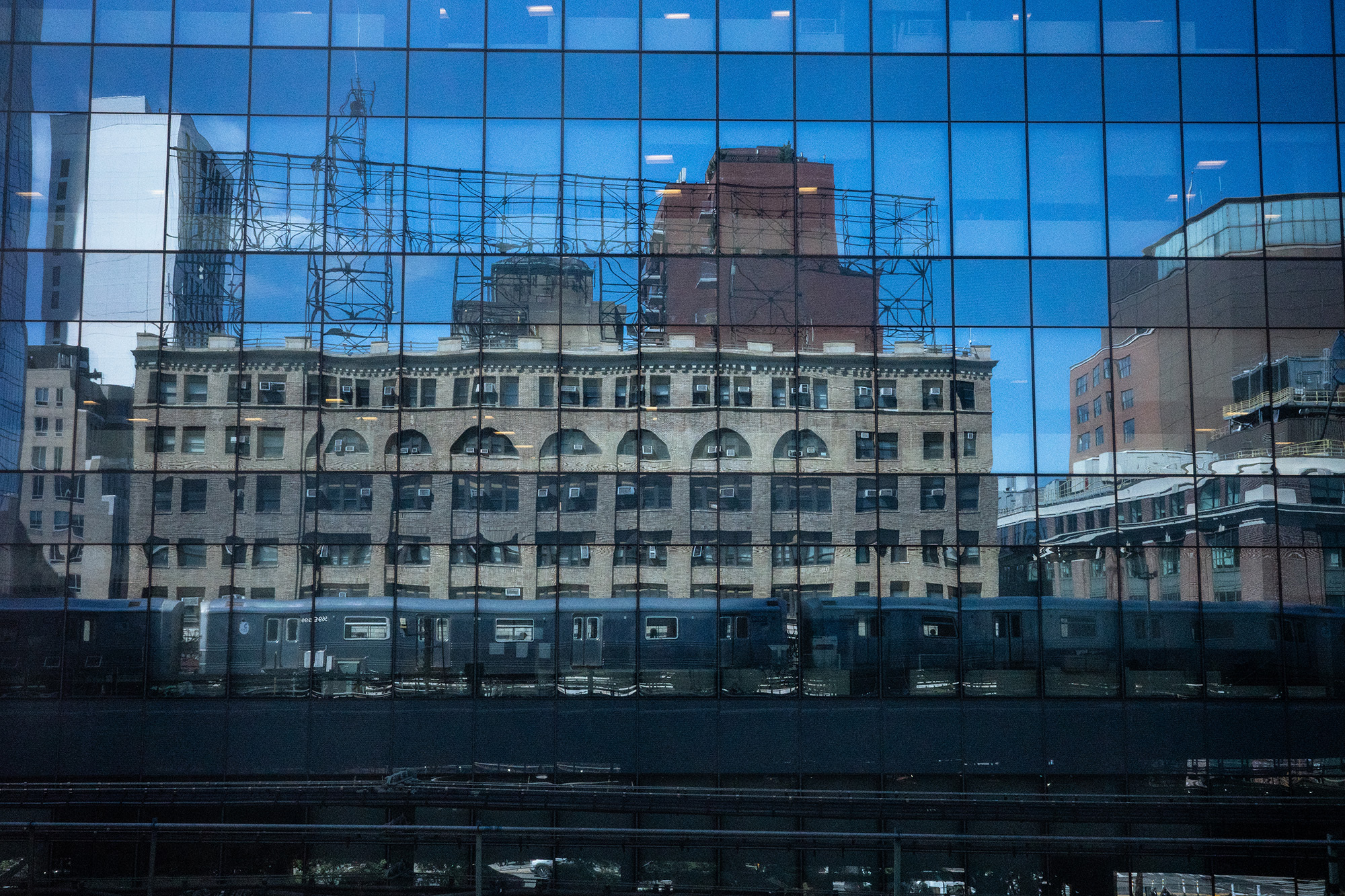 <p>The subway and some skyline reflect in the mirrored windows of new office blocks in Queensboro Plaza.</p>