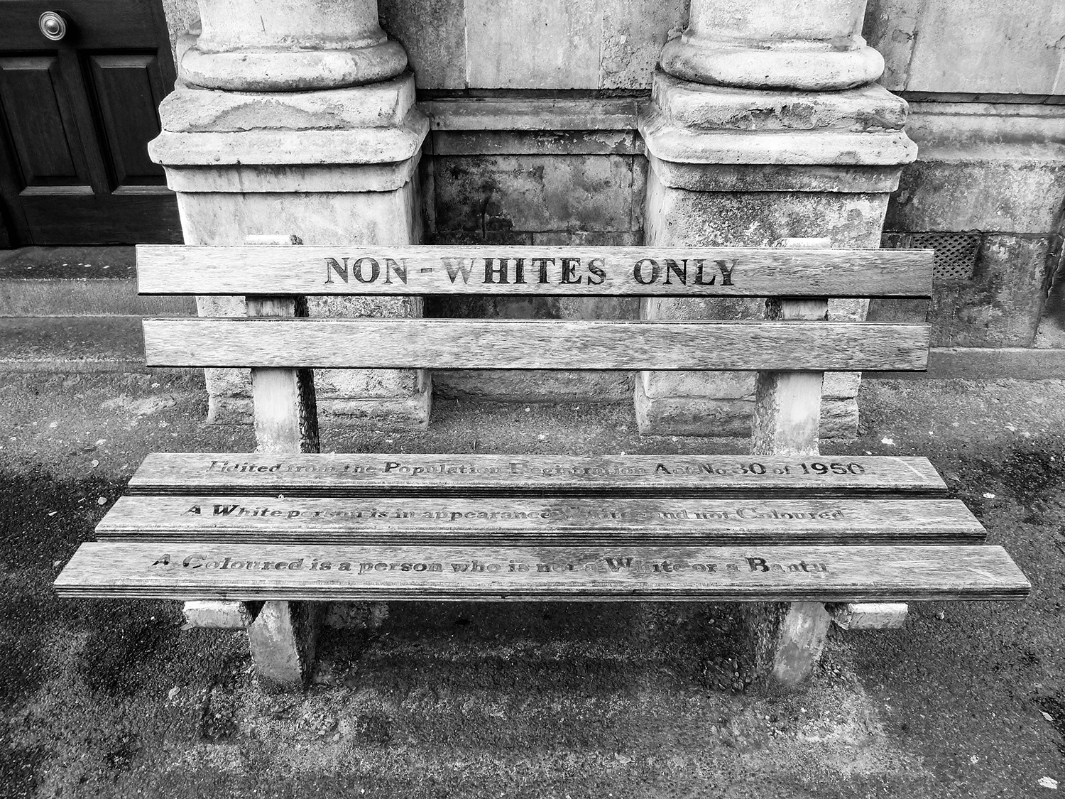 <p>As part of a memory project, artist Roderick Sauls installed two replica Apartheid-era benches outside the High Court Annex in Cape Town in 2007. It was here that race classification hearings took place based on the Population Registration Act (in effect from 1950 to 1991). A second law, the Separate Amenities Act of 1953, ensured the pseudo-mantra of 'separate but equal' by installing facilities like benches and water fountains designated 'Whites only' or 'Non-whites only'. <br /></p><p>Sauls' benches quote precise definitions from the legal text as a reminder of the fallacy, and provoke quite a reaction when stumbled upon...</p>